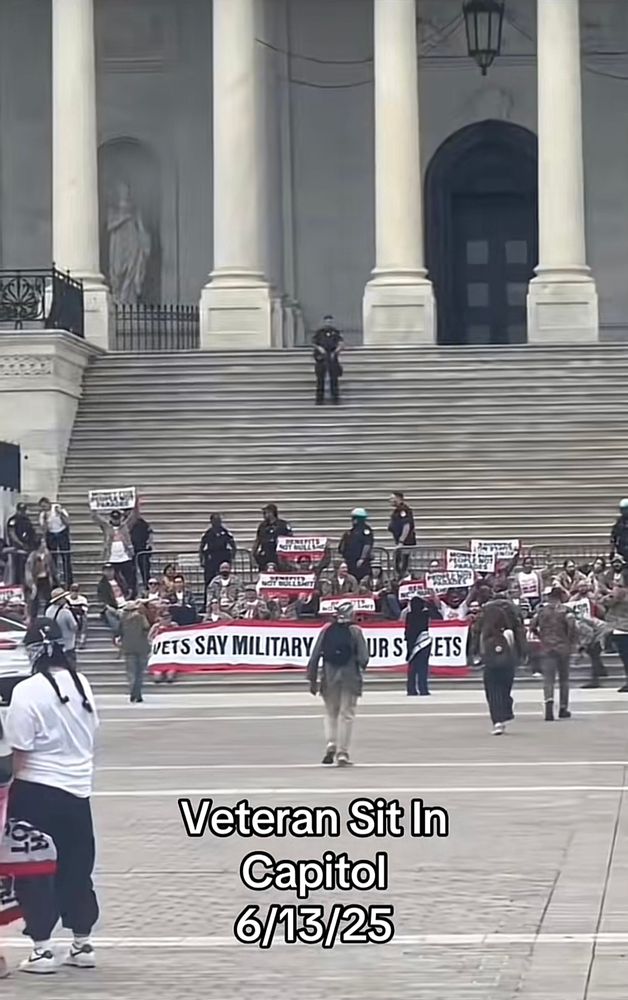 A view of the veterans peacefully protesting being surrounded by police