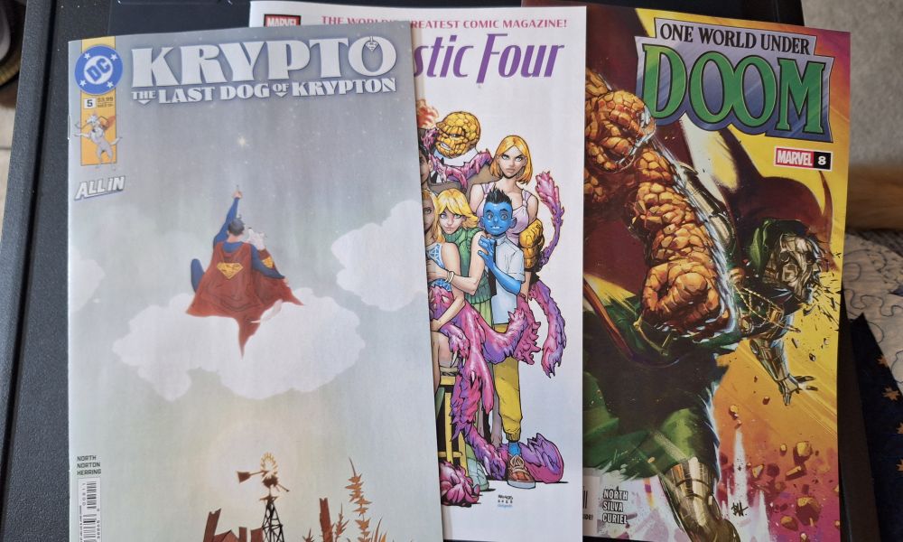 Comics laid out l to r: Krypto the Last Dog of Krypton, Fantastic Four, One World Under Doom. 