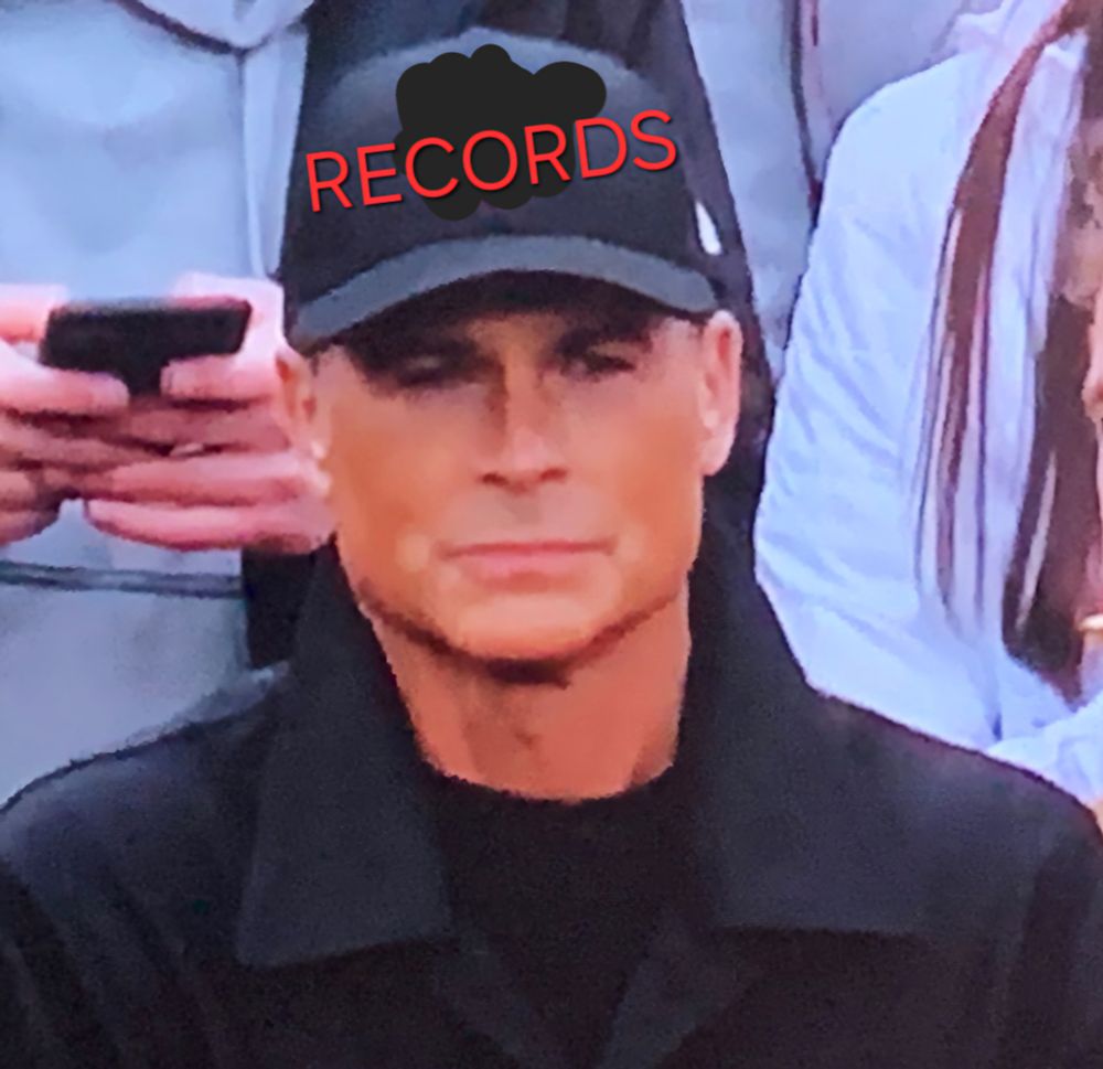 The Rob Lowe NFL hat meme, but with the hat shoddily edited to say RECORDS.