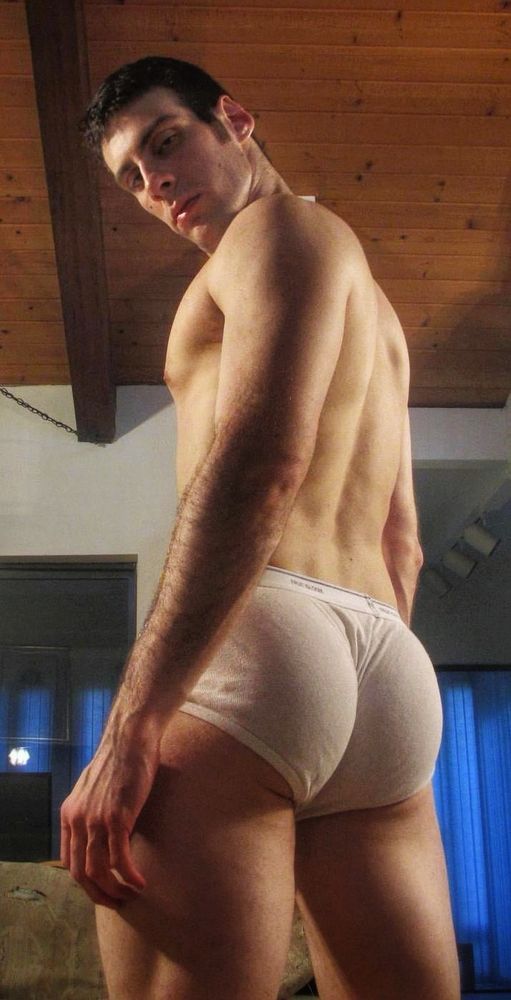 Adult gay porn model shows off his ass in tighty-whities 