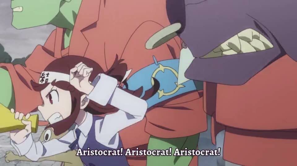 Akko from Little Witch Academia wearing a unity headband and standing in a group of working class monsters yelling into a bullhorn 