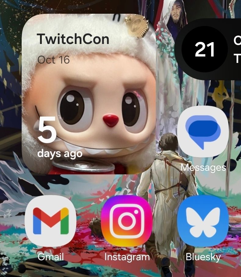 Phone home screen showing apps and a widget of a calendar countdown to Twitchcon 2025. Other icons include messages, gmail, instagram, and bluesky.