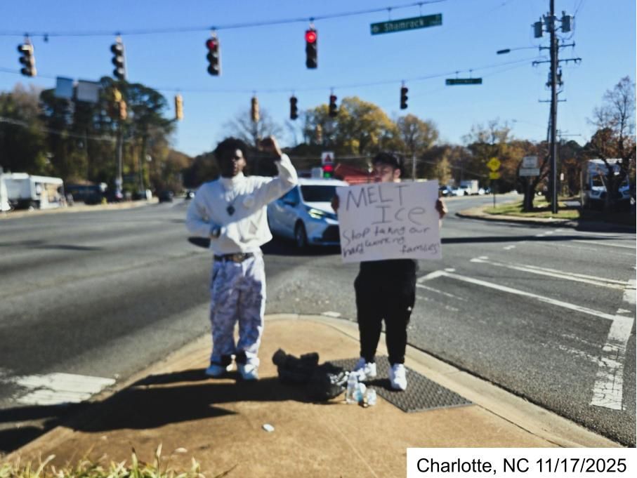 Two teens stand at an intersection, holding an anti-ICE protest. One of the teens is holding his first in the air with strength. He is tall and Black. He was the vocal member of the protest and engaged with the cars as they passed by. They only had one negative interaction.

The other teen was more reserved and appeared to be Latino, putting himself at greater risk regardless of his identity. While he was quiet, he spoke through his sign: MELT ICE Stop taking our hard working families

They are standing on a very small corner of concrete with a complicated intersection behind them. Its a busy intersection but cars also speed by, making them very visible but also vulnerable.