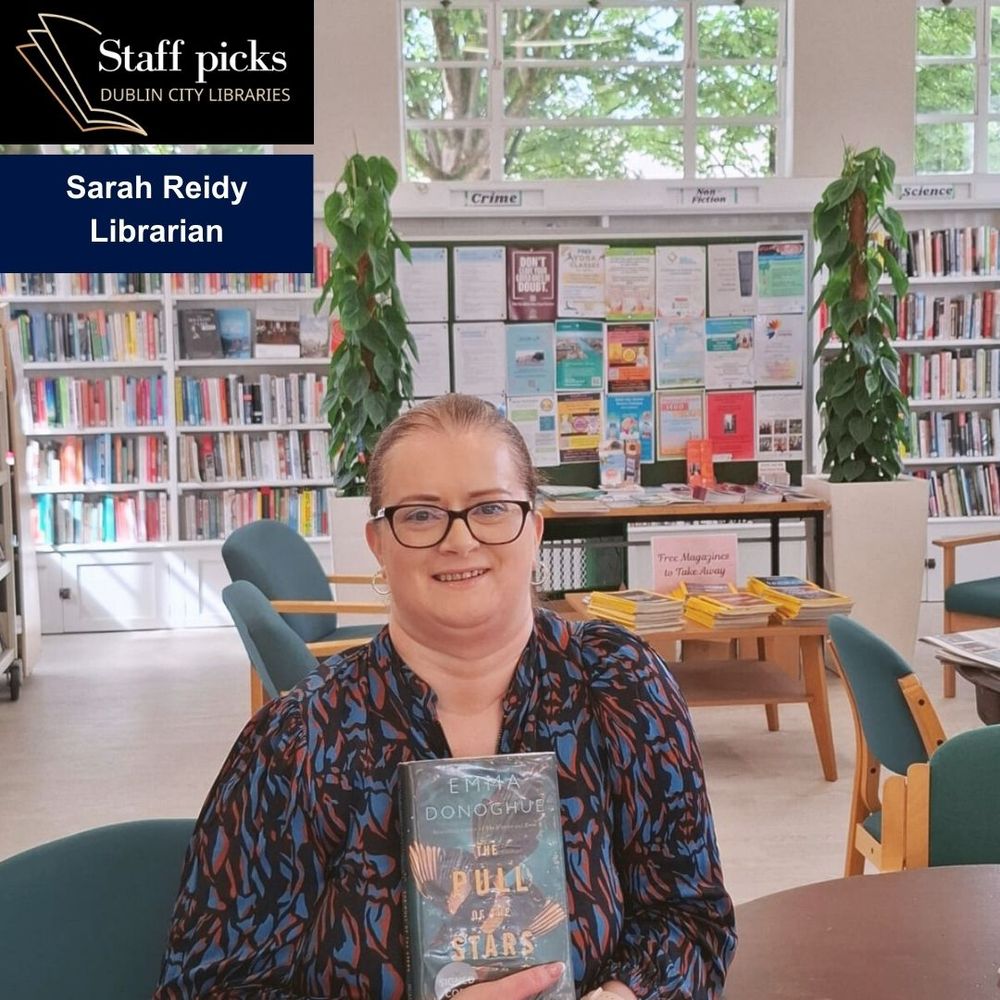 Librarian holding book