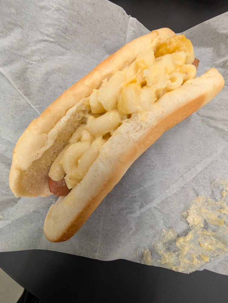 a pale looking hotdog with macaroni as a topping from IKEA