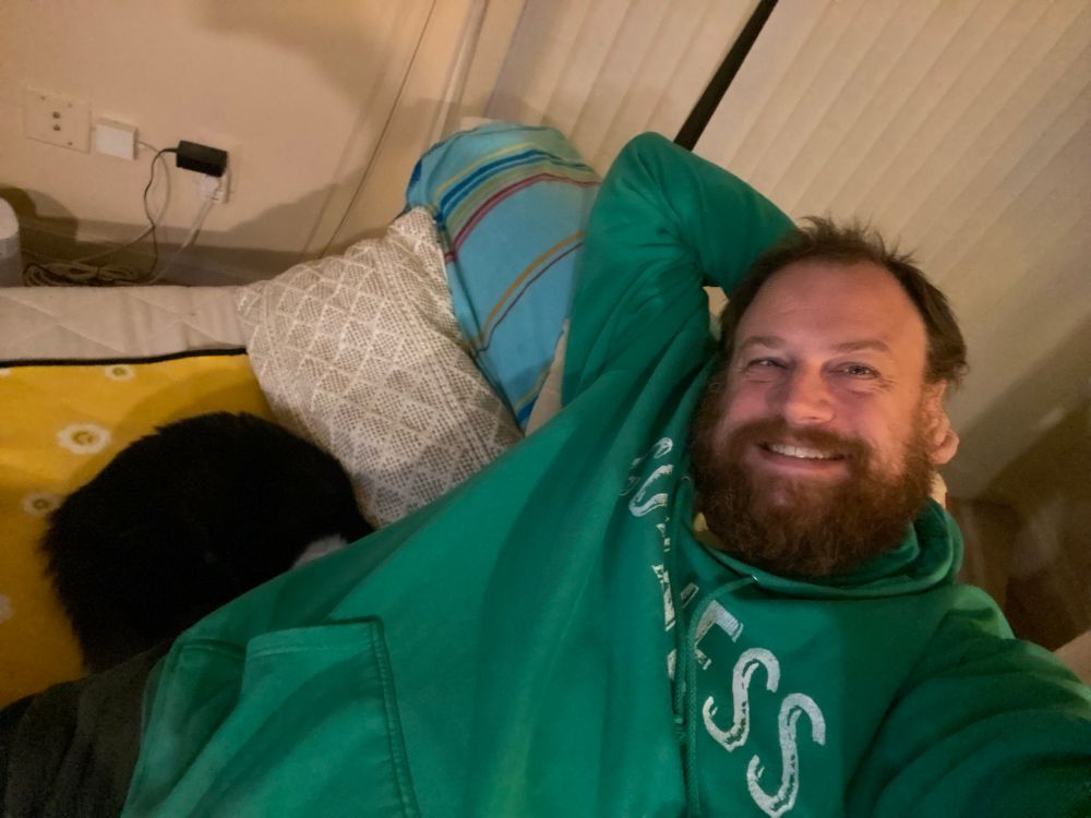 A ball of fluff with her head burrowed against my butt. 