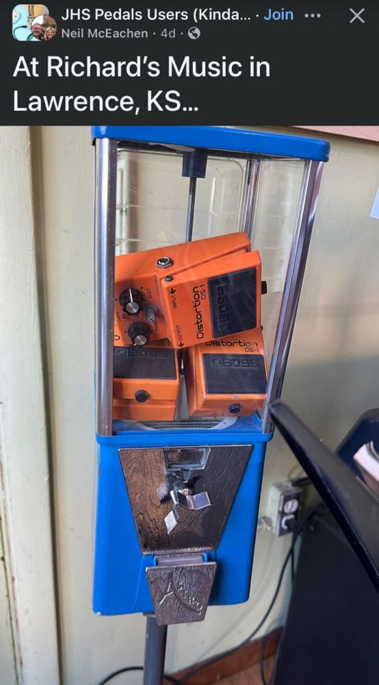 A Facebook account called “JHS Pedals Users” posted a picture of a gum ball machine with three guitar pedals inside. Caption says “At Richard’s Music, Lawrence Kansas”