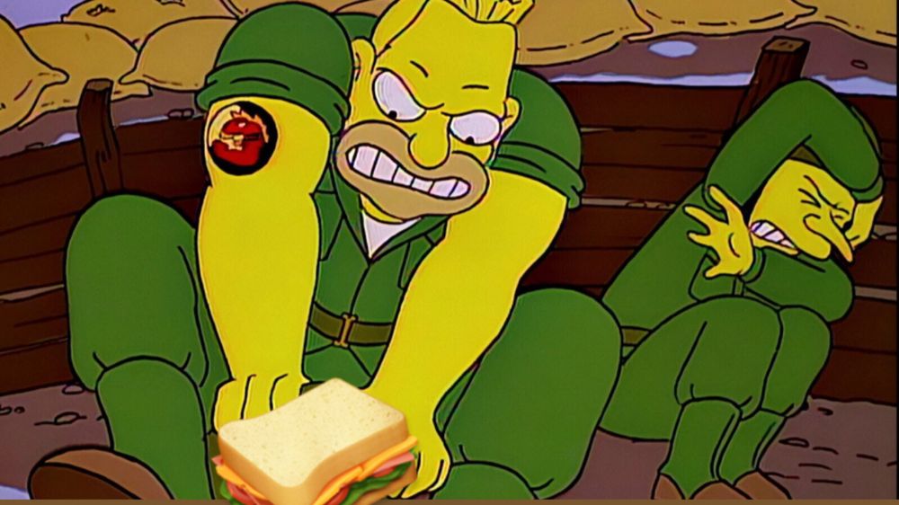 Abe Simpson(?) shielding a fellow soldier from a dangerous sandwich. 