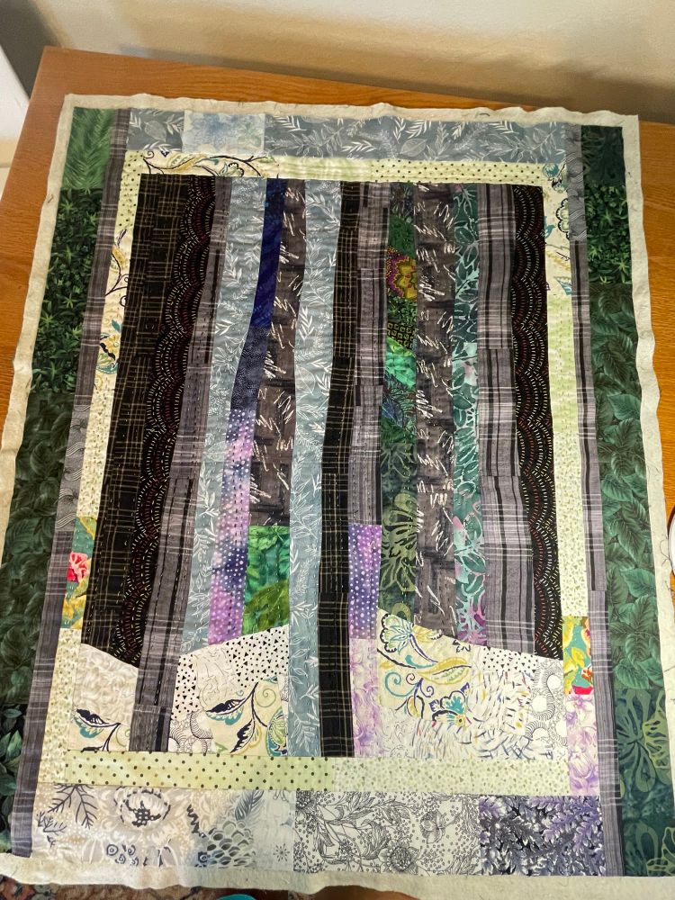 All most finished. Quilt titled Spring Thaw. Machine pieced, hand quilted 