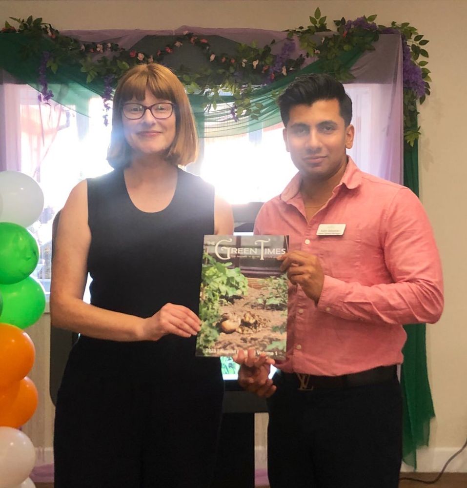 Katherine and General Manager Subin Sebastian holding the Green Times magazine