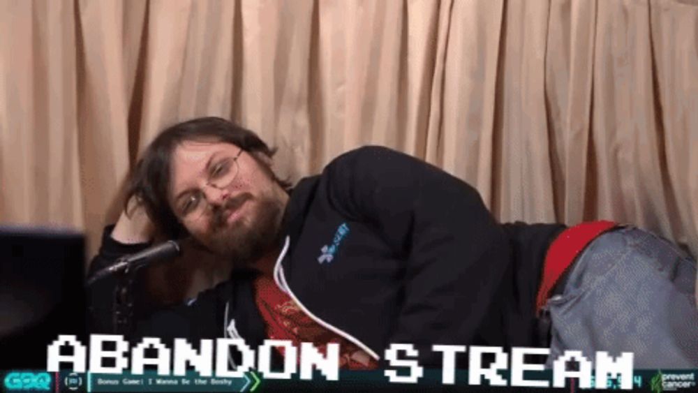 a man laying on the floor with the words abandon stream behind him