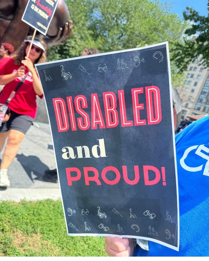 A rally poster boldly declares: “Disabled and Proud!”