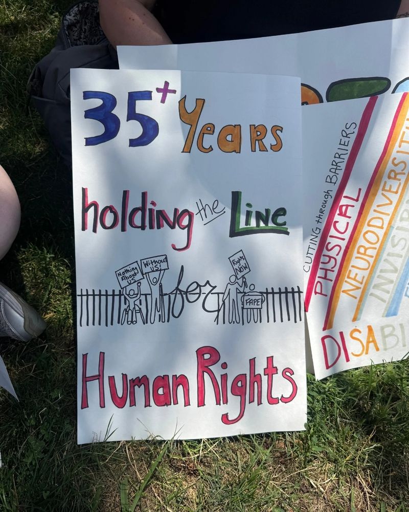 A poster proclaims: “35 Years Holding the Line for Human Rights.”