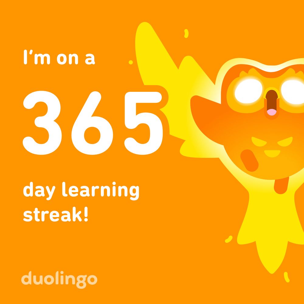 Duolingo 365 day streak banner with Duo the owl rising in flame like a phoenix. 