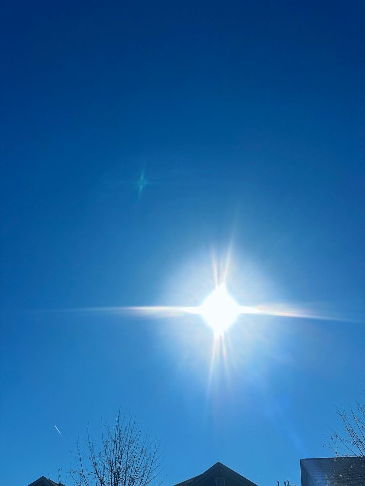 A blue sky and the sun