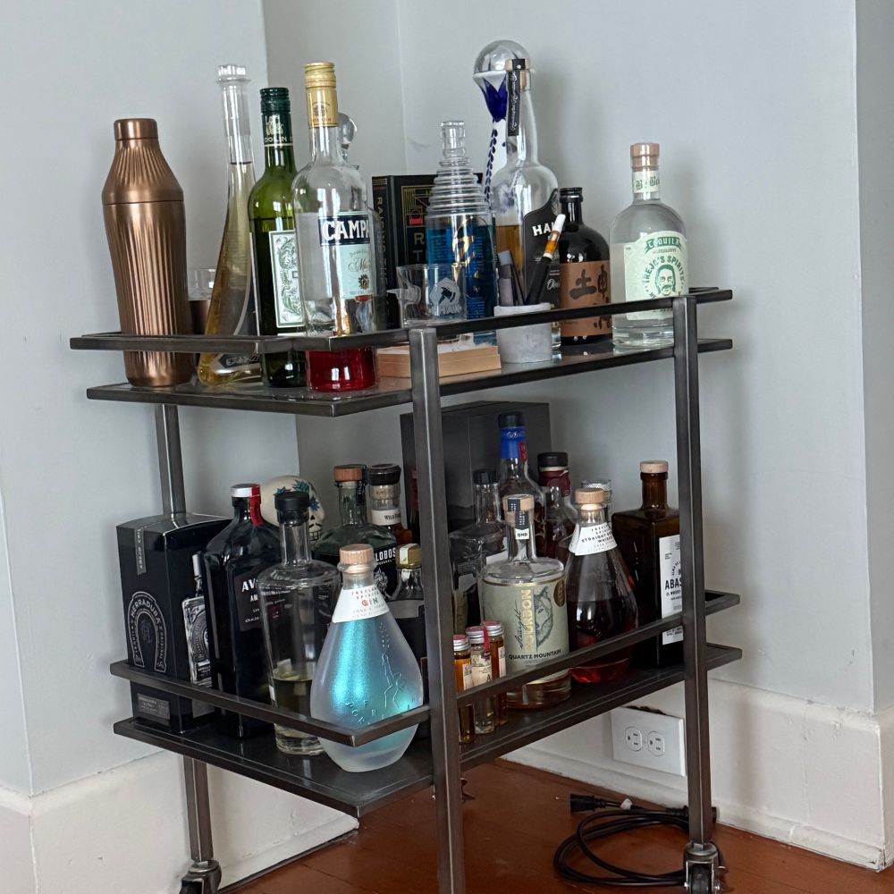 Ah image of an over full stocked bar cart