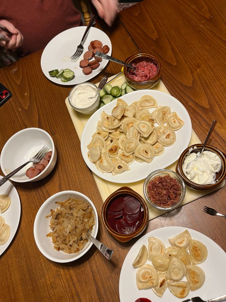 Pierogi board with mini pierogi, caramelized onions, bacon bits, kielbasa, pickles, pickled beets, sauerkraut & sour cream 