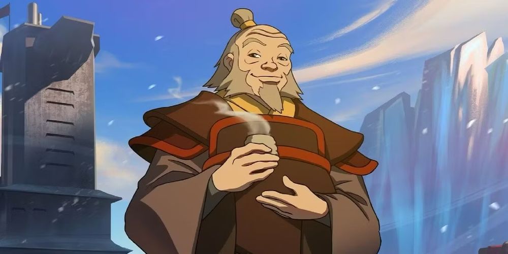 Uncle Iroh, an old white man with a grey hair bun and beard, stands on a metal ship in front of an iceberg. He is wearing brown and red robes and holding a warm cup of tea. 