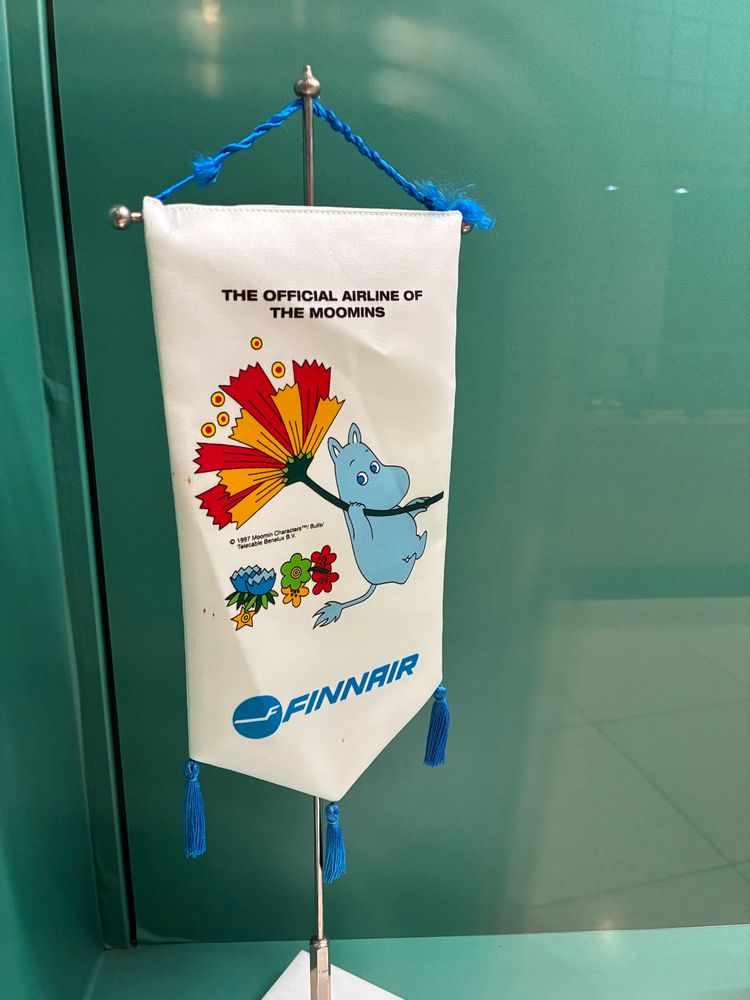 A little pennant reading 

THE OFFICIAL AIRLINE OF THE MOOMINS
FINNAIR