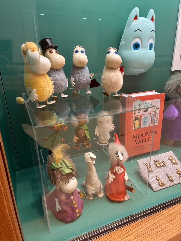 Tiny Moomins characters and some enamel pins