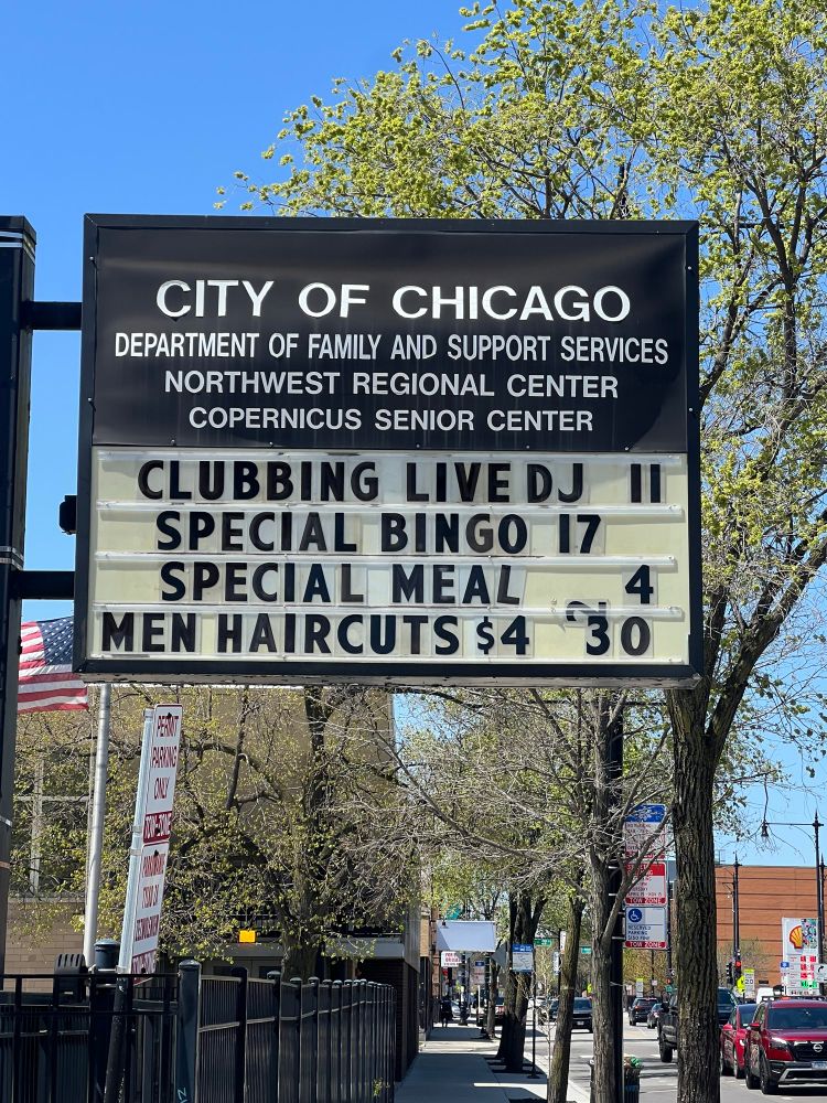 Chicago Department of Family and Support Services sign advertising a “Clubbing Live DJ” event