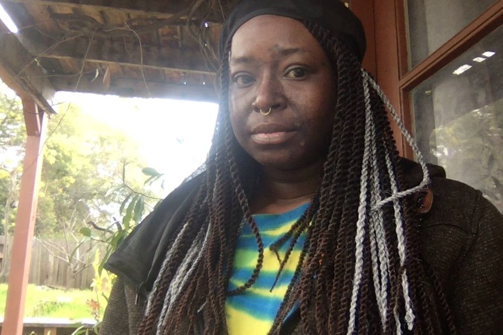 an image of a black trans man with senegalese twists