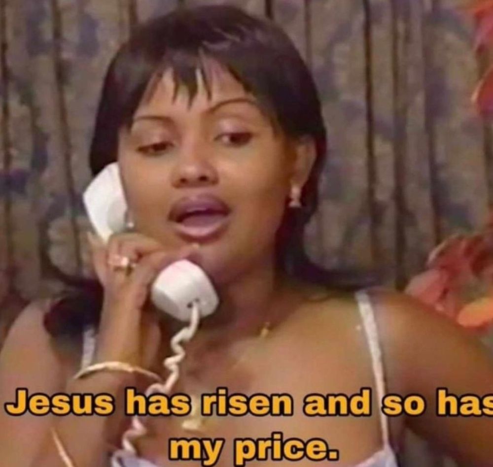 A Black woman with a bang and a lil flip is on a corded phone saying “Jesus has rise. And so has my price”