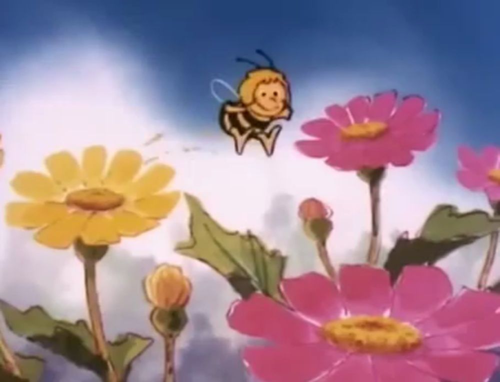 a cartoon bee is flying over a field of pink flowers .