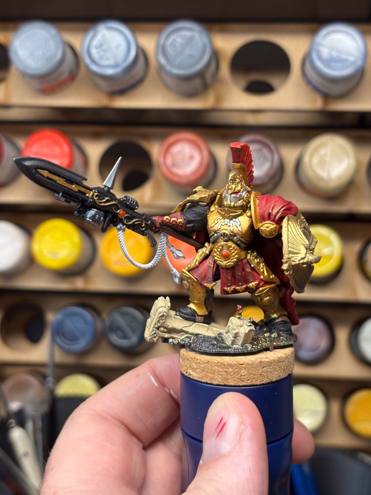 A custodes shield captain miniature.