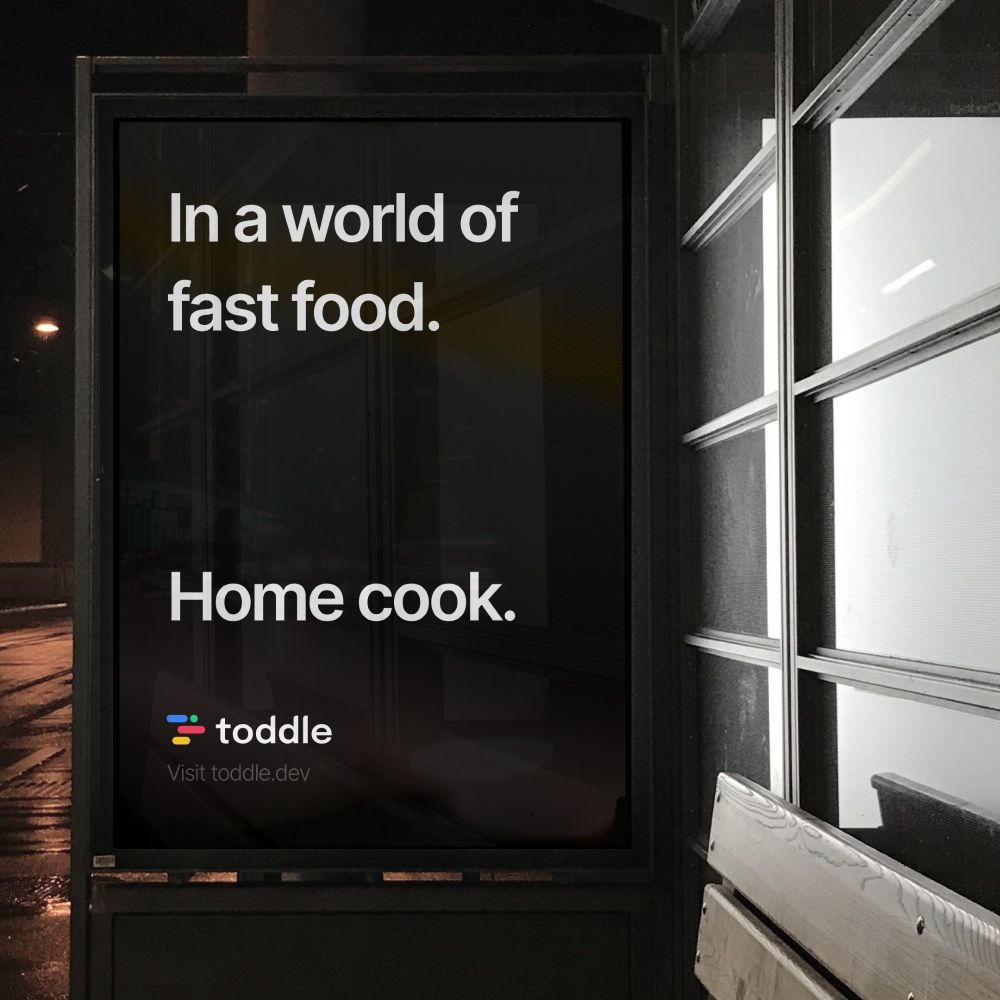 A poster in the street that reads: "In a world of fast food—Home cook."