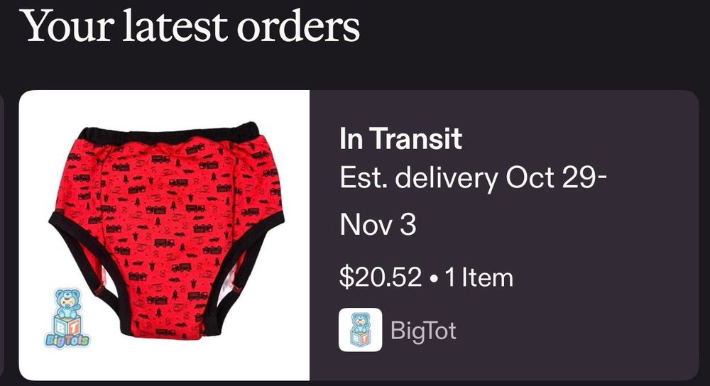 Red and black training pants with truck design