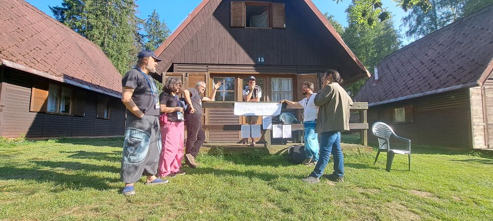A group of scientists debating beauty and science in the woods of Bohemia.