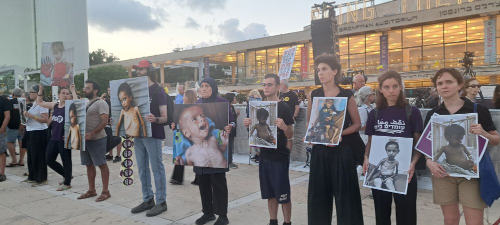 Protesters in Tel Aviv hold photographs of emaciated Palestinian children in Gaza, July 31, 2025