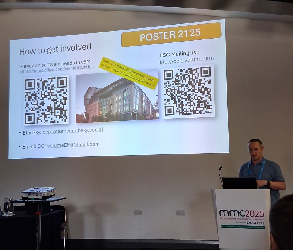 man stands by PowerPoint slide sharing qr codes for a survey and mailing list for image analysis of volume EM data