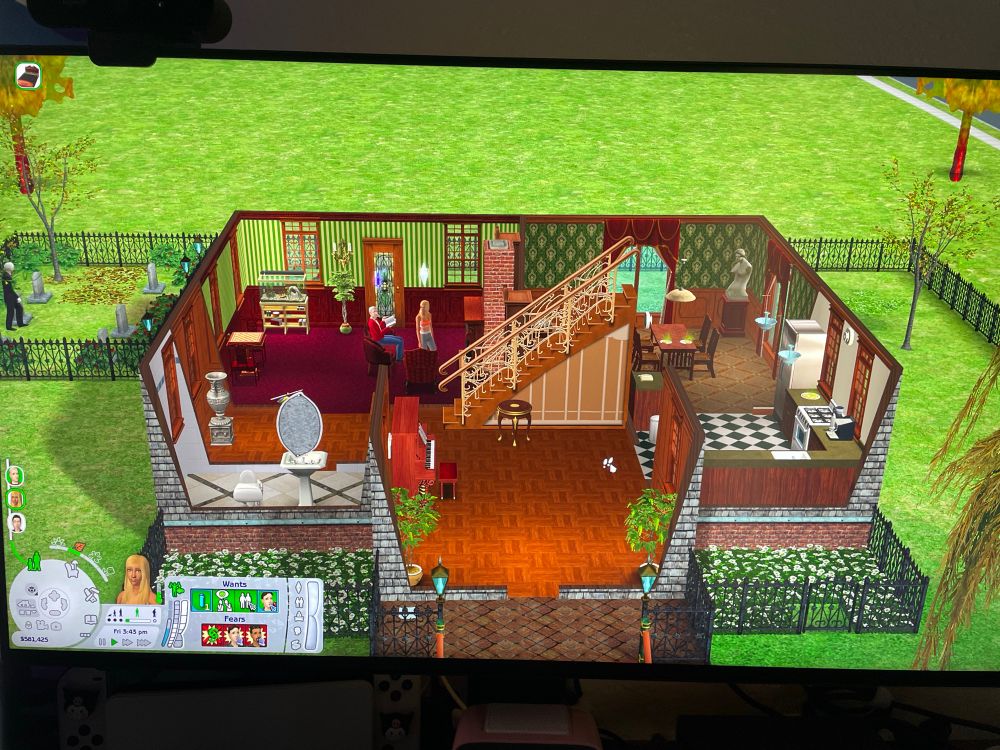 Playing The Sims 2 with the Goth household. In my version Dina Caliente married Mortimer Goth.
