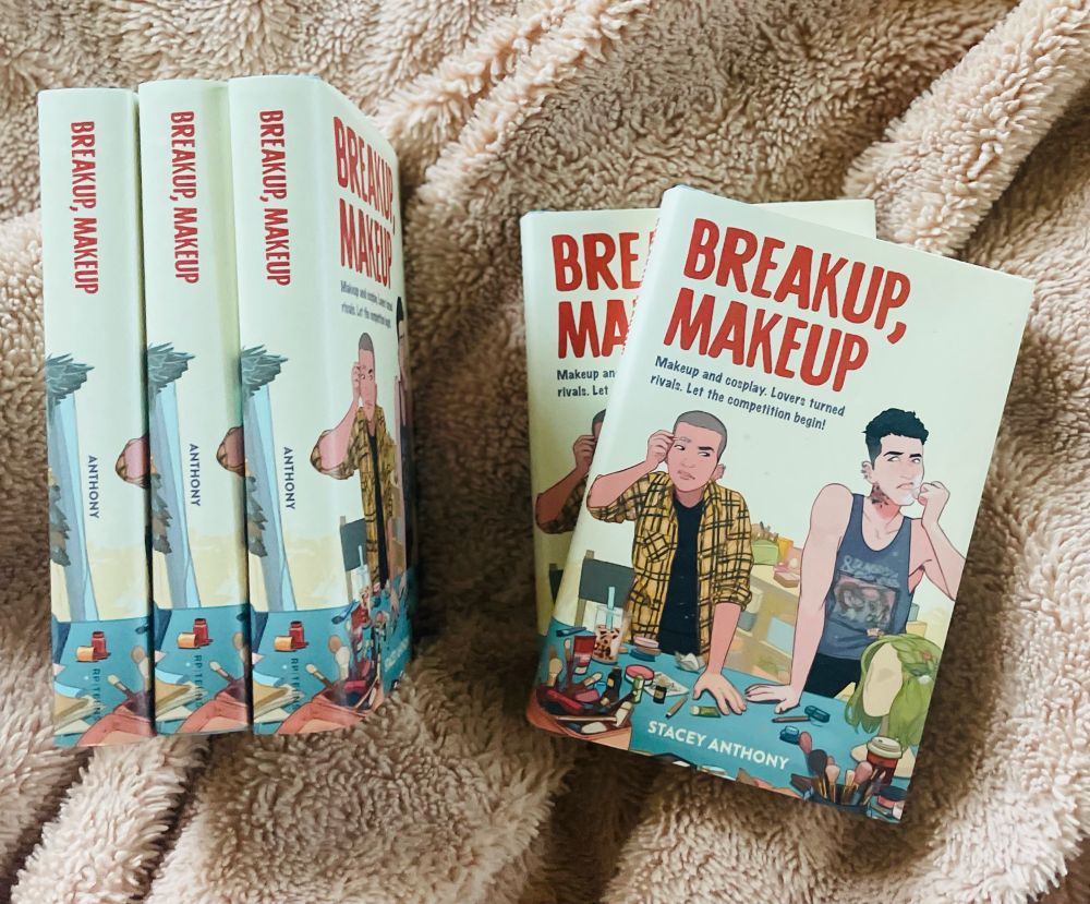 book called BREAKUP, MAKEUP featuring two young adults doing their makeup