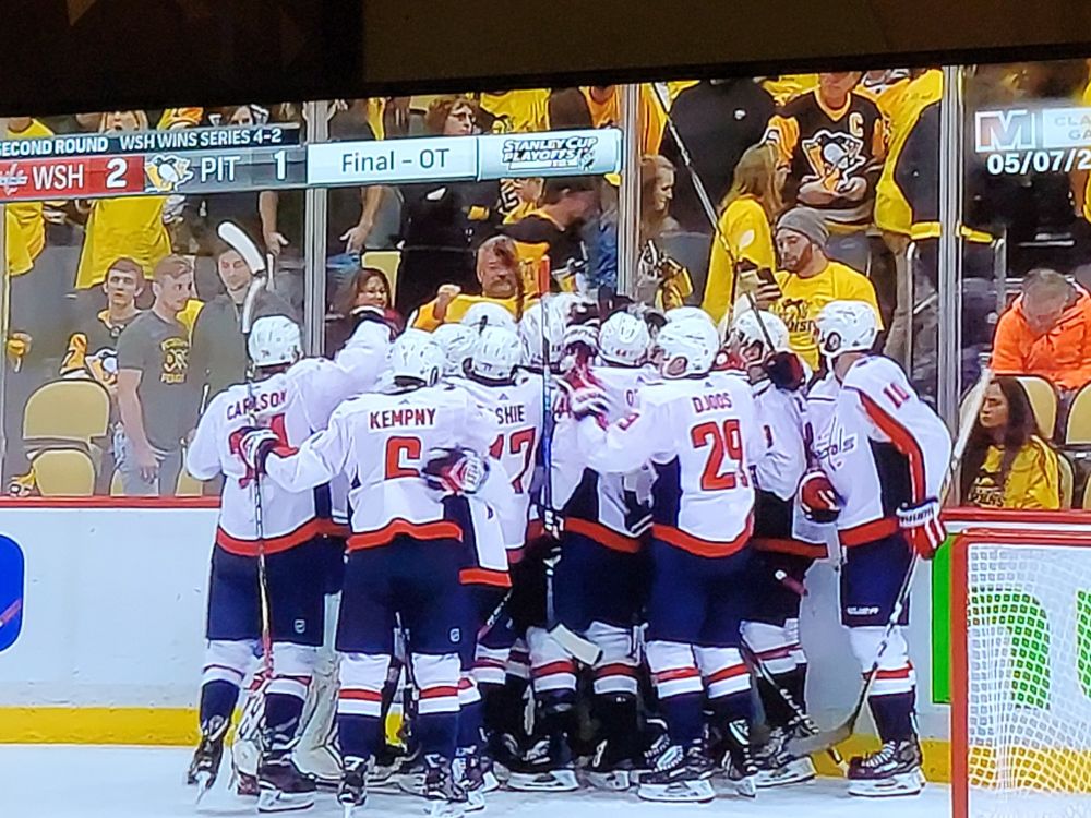 The Washington Capitals celebrate after Evgeny Kuznetsov scores an overtime goal to secure game 6 and the series over the Pittsburgh Penguins in a second round playoff series, 5/7/2018. The Capitals would go on to win the Stanley Cup Final that year.