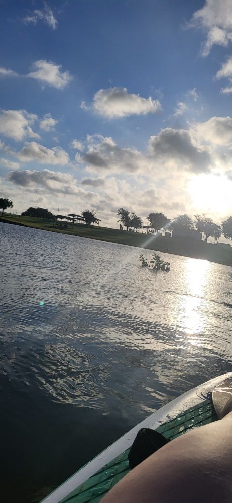 Top half is sky buttom half is water. A little stand up paddle board in the bottom right hand corner