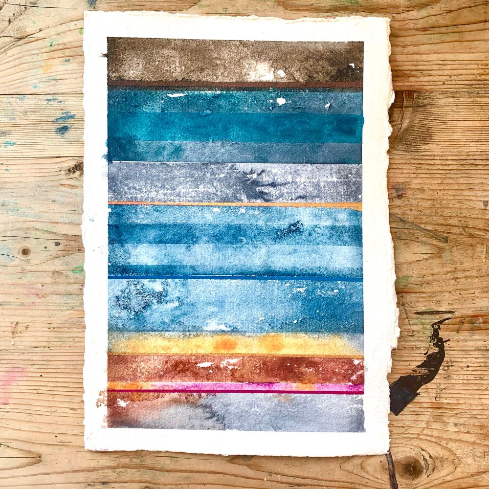 Watercolour painting representing my abstract, colour-based take on Venice: horizontal stripes in shades of indigo, grey and turquoise for the sea, and dark brown, yellow, pink with a trim of gold for the buildings and the glorious art.