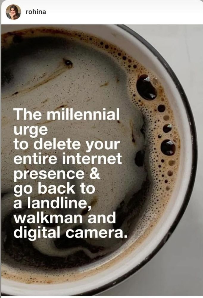 A cup of coffee viewed from above. White text reads "The millennial urge to delete your entire internet presence & go back to a landline, walkman and digital camera." 