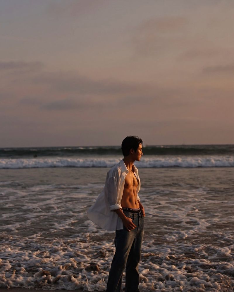 Seonghwa at the beach SHIRT OPEN looking mighty fine as well