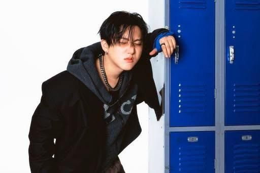 Changbin's photo concept for Karma, leaning on a locker, pouting!