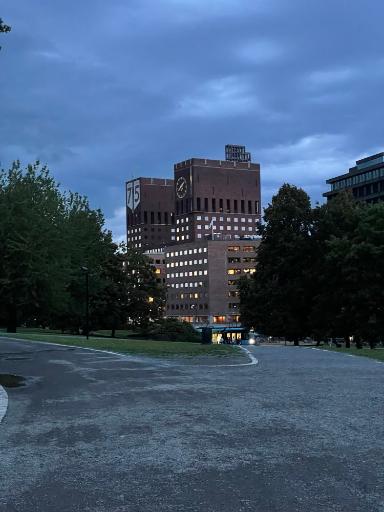Oslo Town Hall seen from the park behind, among the trees