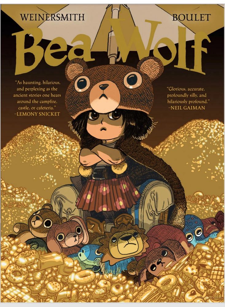 Cover of the children’s book Bea Wolf by Weinersmith and Boulet. A small child stands on a treasure hoard of golden candy and toys. She wears a stuffed bear as a helmet and cloak. Her arms are folded across her chest. She looks serious and determined.