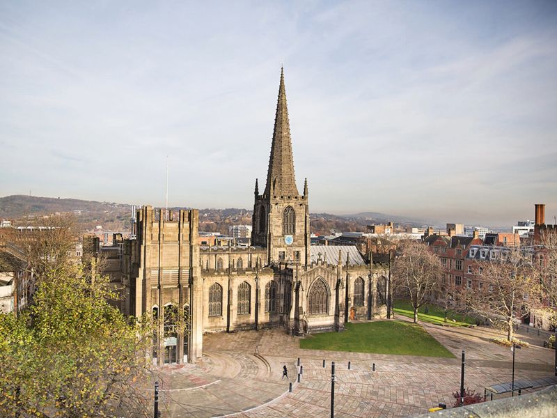 View looking down over Sheffield Cathedral, a grand, historic looking building. 