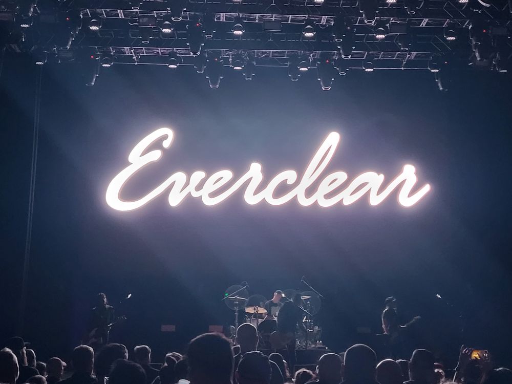 White glowing sign that reads "Everclear" behind the band Everclear playing at the Emerald Queen Casino on September 14th, 2025.