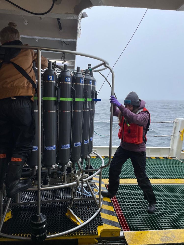Fadime prepares to collect seawater samples from the CTD rosette on the deck of the R/V Atlantic Explorer during a stormy day at sea. Photo by Loay Jabre. 