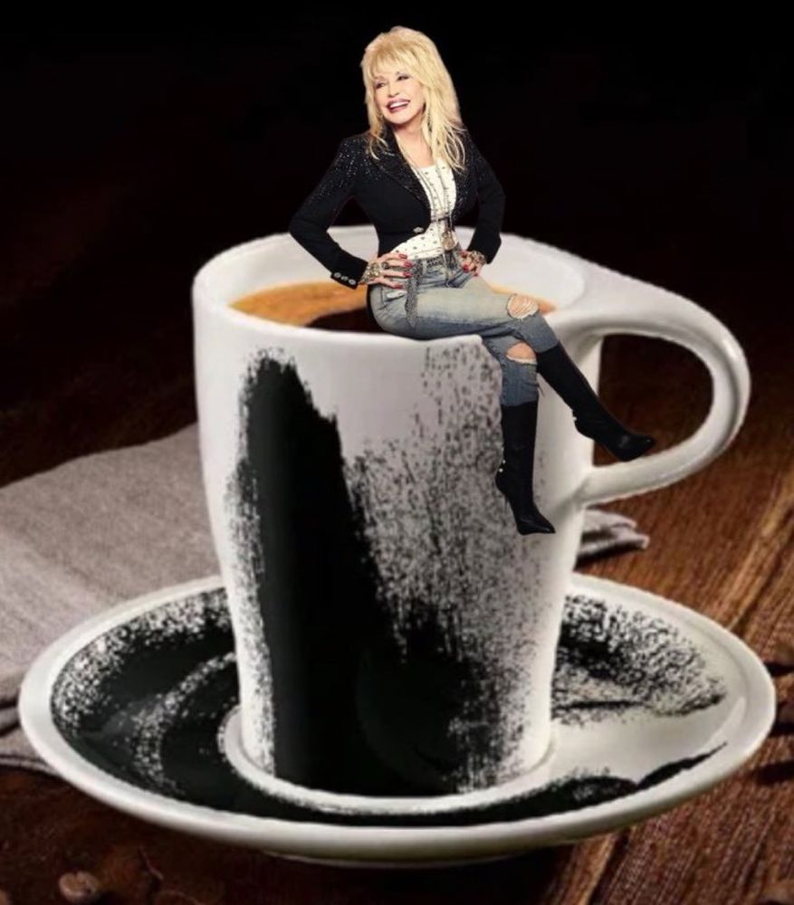 Dolly Parton sitting on the rim of a black and white coffee cup with matching attire. 