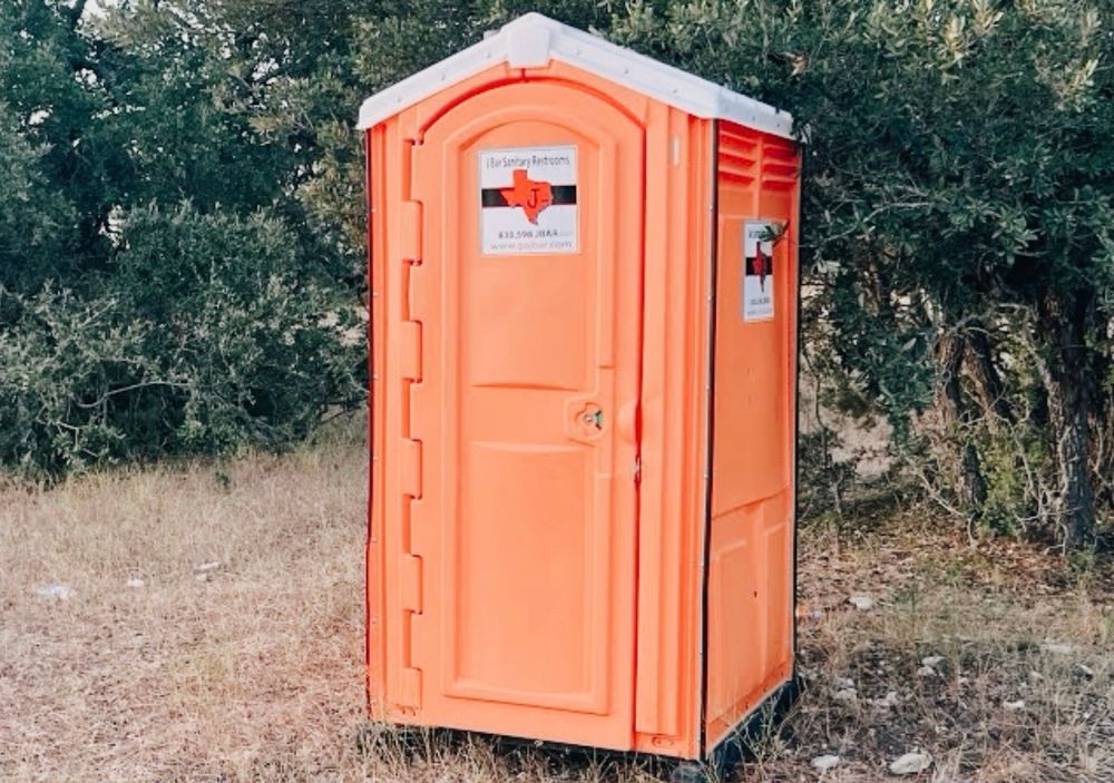 Porta potty the same shade of orange as the dickhead’s tan. 