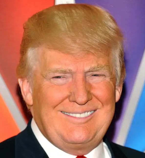 Donald Trump wearing his signature orange tan looking like a stupid idiot. 